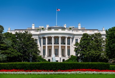 USA, Washington D.C., White house with green grass and summer sky