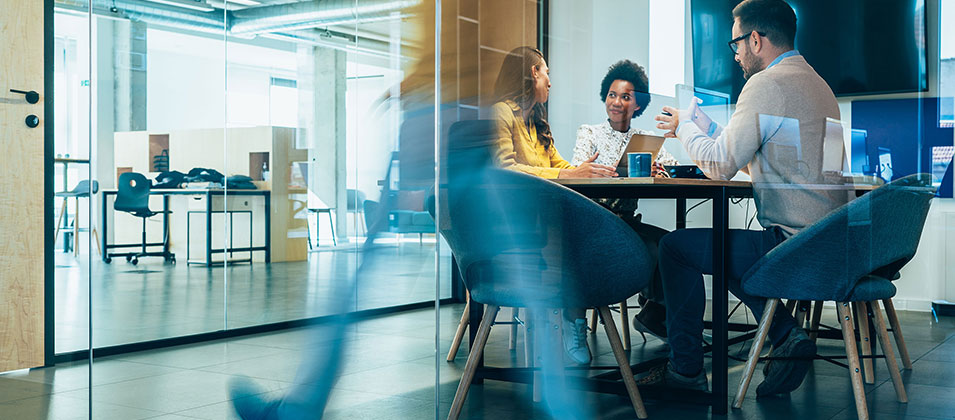 People having meeting at desk